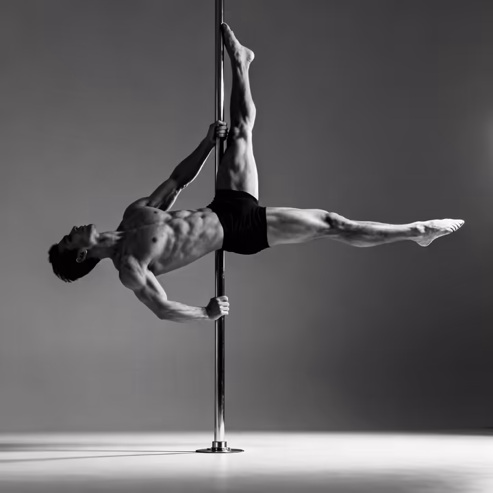 An advanced pole dancer holding a difficult horizontal pose, illustrating the concept of functional strength.